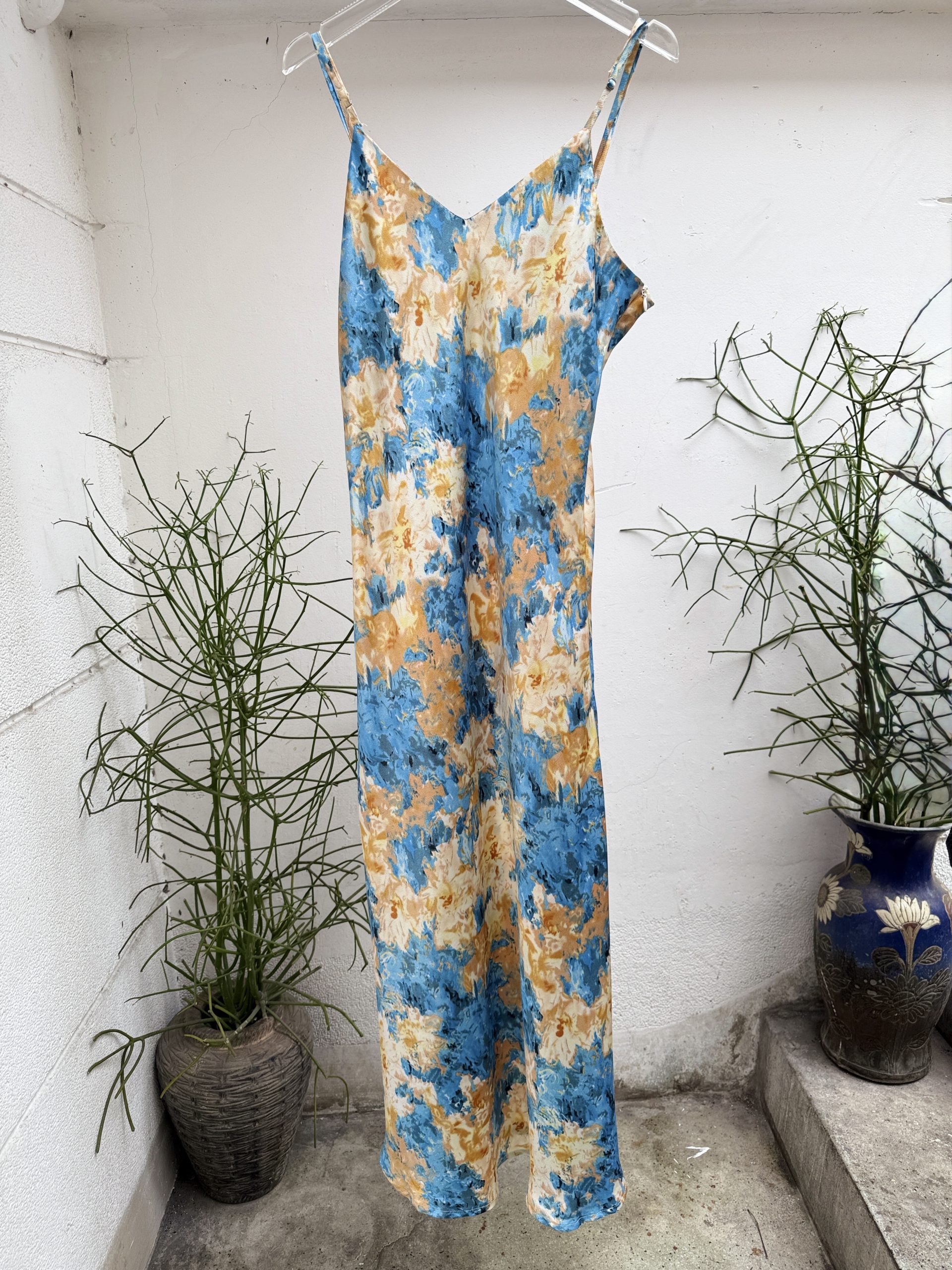 Eclectic assortment of vintage spaghetti strap dresses and slip dresses at Inspirée Vintage, District 1 Saigon